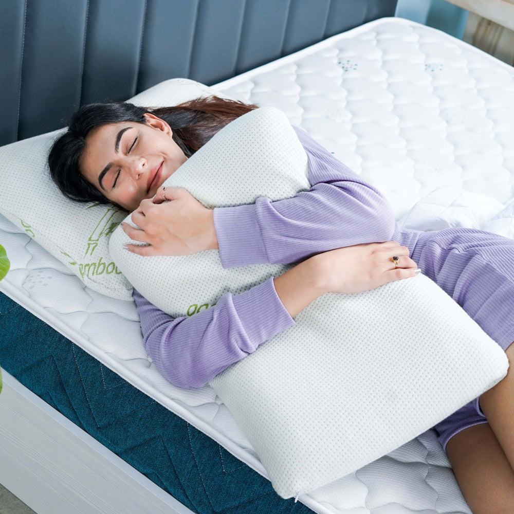 Girl holding pillow on Hybrid Pocket mattress